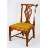 An 18th century mahogany side chair, with pierced splat, on canted block supports,