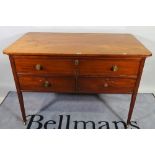 A 19th century mahogany sideboard/ serving table, the drop dummy drawer,
