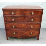 A George III mahogany chest of two short and three long graduated drawers on bracket feet,