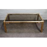 A 20th century lacquered brass rectangular coffee table, with faux bamboo supports,