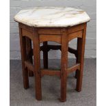 An onyx topped octagonal side table, on an Arts and Crafts oak stand, 61cm wide x 70cm high.