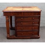 A Victorian mahogany flat topped Davenport, the hinged leather inset top over four side drawers,