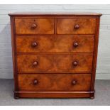 A Victorian figured walnut chest of two short and three long graduated drawers, on plinth base,