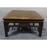 An early 20th century Chinese stained pine square low table, 93cm wide x 50cm high.