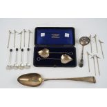 Silver, comprising; two similar Victorian preserve spoons, the handles modelled as leaves,