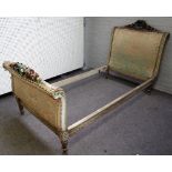 An early 20th century North European polychrome painted scroll end single bed,