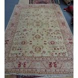 A Turkish carpet, the golden field with an allover floral design,