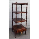 A Victorian rosewood four tier what-not with single drawer base on turned supports,