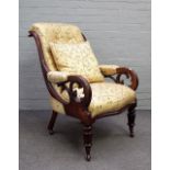 A William IV mahogany framed open armchair in silk bird print upholstery, on reeded supports,