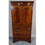 A Regency style mahogany linen press over four long drawers on bracket feet, 73cm wide x 152cm high.
