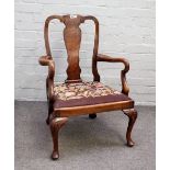 An early 18th century style figured walnut child's vase back open armchair on shell capped cabriole