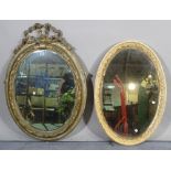 A Regency style giltwood oval wall mirror with ribbon tied crest,