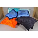 Versace; a pair of blue silk cushions, 40cm wide,