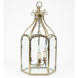A Victorian style brass hall lantern of hexagonal form with an internal three light fitment,