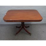 A Regency mahogany breakfast table, the rounded rectangular snap top on four downswept supports,