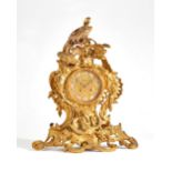 A Rococco style gilt bronze mantel clock, late 19th century,