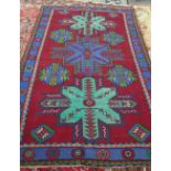 A Turkish rug, three medallions, 242cm x 147cm.