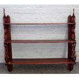 A set of mahogany hanging wall shelves, with pierced fret sides, 94cm wide x 92cm high.