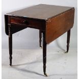 A late Victorian mahogany Pembroke table with single drawer, on ring turned supports,