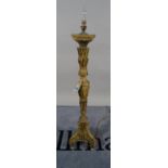 An 18th century giltwood altar candlestick (converted into a table lamp), carved foliate detail,