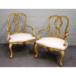 A pair of 18th century style polychrome painted open armchairs,