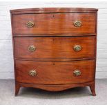 A Regency inlaid mahogany bowfront chest with three long graduated drawers, on splayed bracket feet,