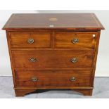 An Edwardian mahogany chest of two short and two long drawers, 106cm wide x 150cm high.