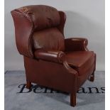 A modern hardwood framed reclining wingback armchair, 88cm wide x 100cm high.