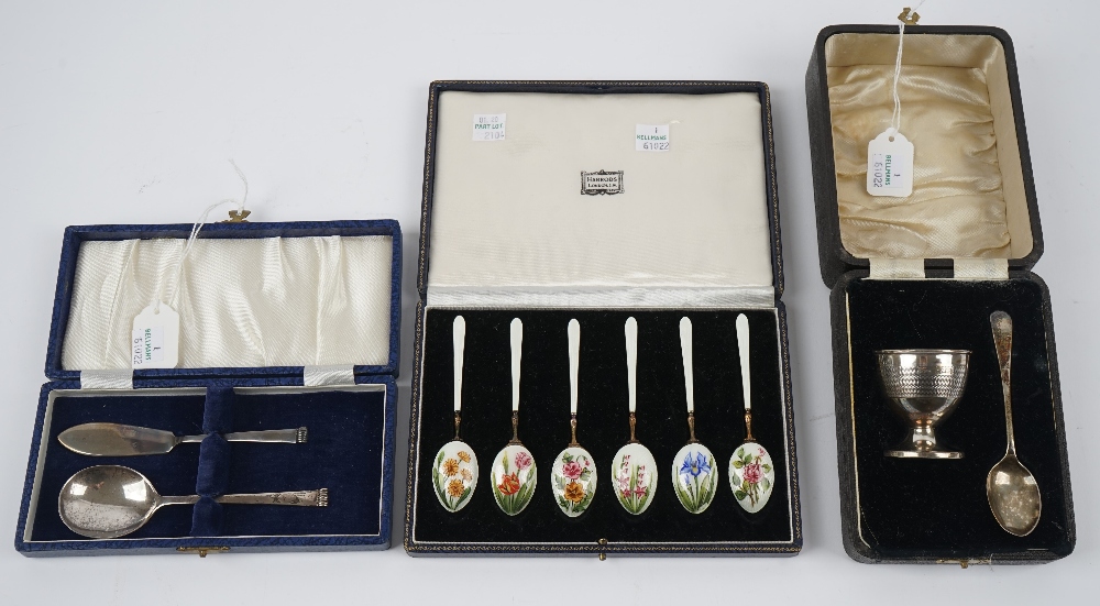 A set of six silver gilt and enamelled coffee spoons,