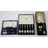 A set of six silver gilt and enamelled coffee spoons,