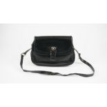 A Gucci style black leather ladies handbag with gilt metal hardware and adjustable shoulder strap,