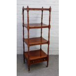 A Victorian rosewood four tier what-not with single drawer base on turned supports,