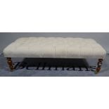 A 20th century hardwood framed rectangular footstool, grey buttonback upholstery on turned supports,