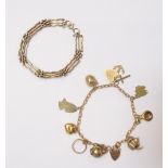 A 9ct gold oval link charm bracelet, with a 9ct gold heart shaped padlock and a boltring clasp,