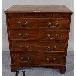 A late George III mahogany chest brushing slide over four long graduated drawers on bracket feet,