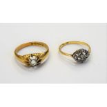 A gold and platinum, diamond set shaped oval cluster ring,