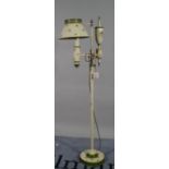 A modern cream and floral painted metal standard lamp in the form of a vintage oil lamp, 180cm high.