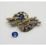 A sapphire and colourless gem set brooch, in a twin spray design,