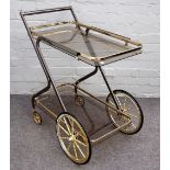 A 20th century lacquered brass and smoked glass two tier drinks trolley, 70cm wide x 81cm high.
