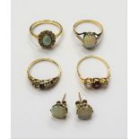 A gold ring, claw set with an oval opal, detailed 9 CT, a pair of opal single stone earstuds,