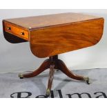 A Victorian mahogany drop flap centre table on turned column on four downswept supports,