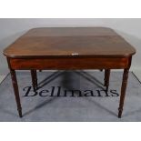 A Regency inlaid mahogany 'D' end extending dining table on turned supports, one extra leaf,