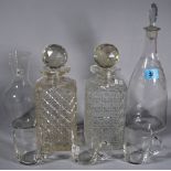 A glass decanter with engraved label, 'White', two square glass spirit decanters,