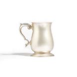 A silver mug, of baluster form, with a scrolling handle, in an 18th century style, Birmingham 1971,