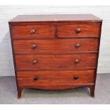 A George III mahogany chest of two short and three long graduated drawers, on splayed bracket feet,