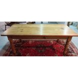A Victorian style rectangular pitch pine table, on turned supports, 92cm wide x 191cm long.