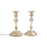 A Belgian pair of table candlesticks, each of cast form, decorated in the Rococo taste,