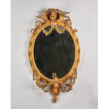 A 19th century gilt framed girandole mirror, with cherub crest and triple branch lower frieze,