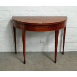 A George III inlaid mahogany semi-elliptic card table, on tapering square supports,