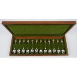 A set of twelve silver floral decorated spoons,